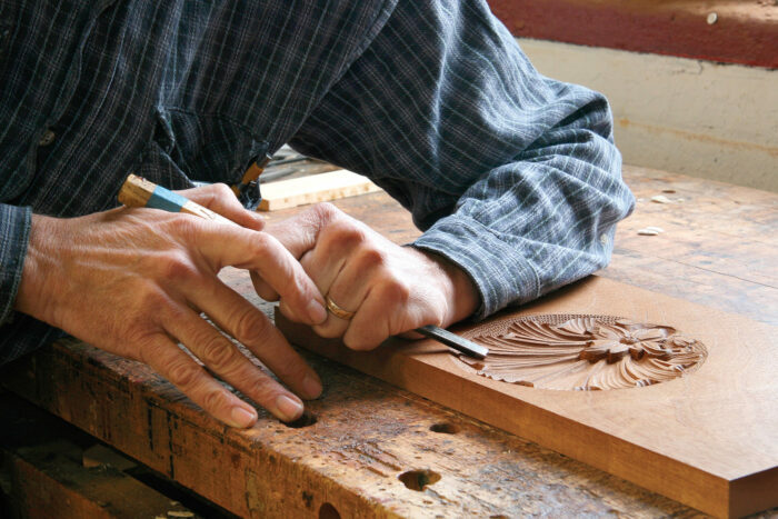 Hands working with wood
